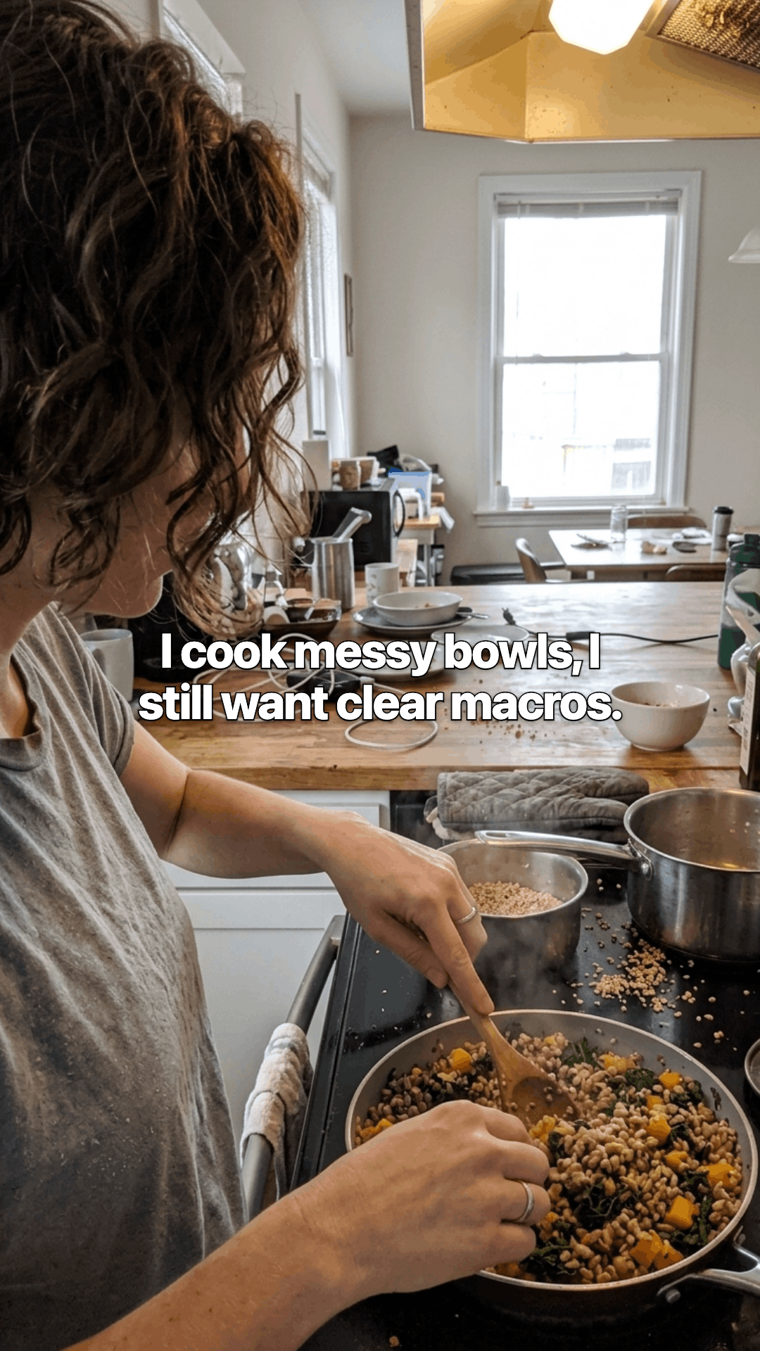 A woman at a stove stirring a pan of grains and vegetables, with a line of the post across the photo.